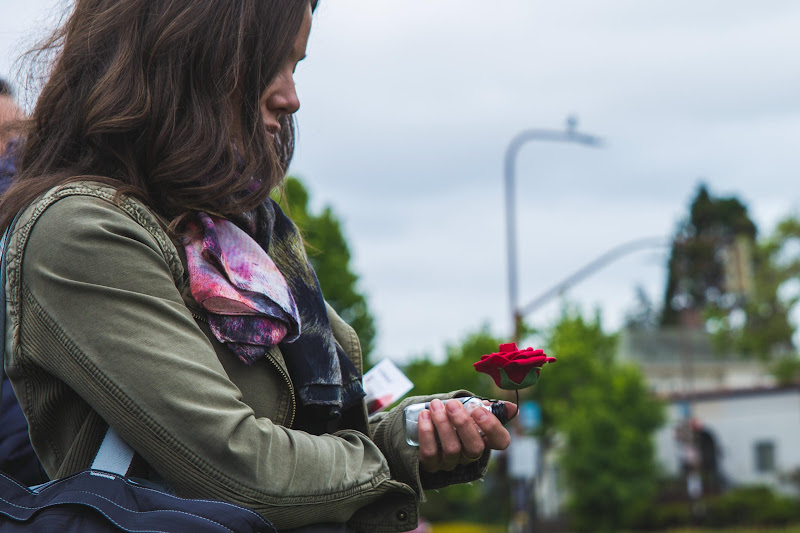 Activist holding a rose - Funeral for farm animals at the Animal Liberation Conference 2018